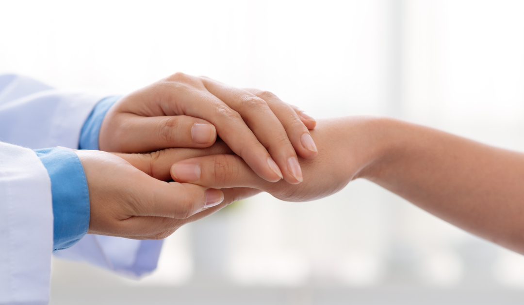 Hand,Of,Doctor,Reassuring,Her,Female,Patient