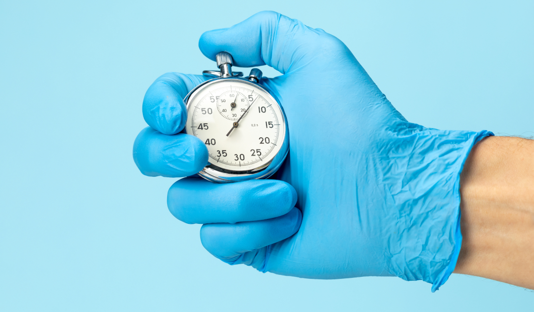 Doctor,In,Glove,Holds,Stopwatch,In,His,Hand.,Fast,Medical
